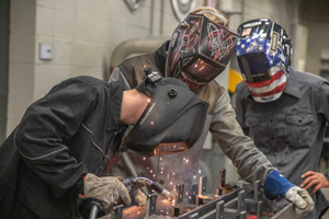 Gateway welding students work on a project that will honor fallen Vietnam War veterans