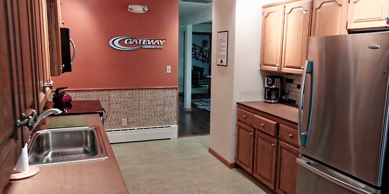 The kitchen at the Center for Sustainable Living is a model of sustainability. In addition to Energy Star appliances and LED lighting, the space features sustainable design features such as natural linoleum, countertops made of recycled paper and cardboard, sorghum paneling and a Bokashi composter. 