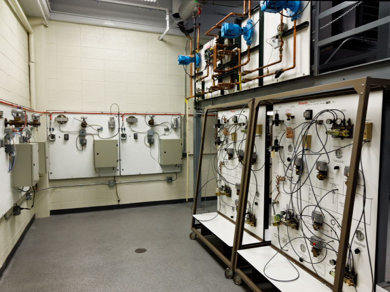 This area of the Commercial Heating and Cooling Lab contains Pneumatic training equipment (lower) and the commercial solar heat trainer (above). 