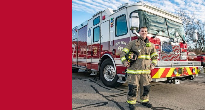 Fire Science student by fire truck