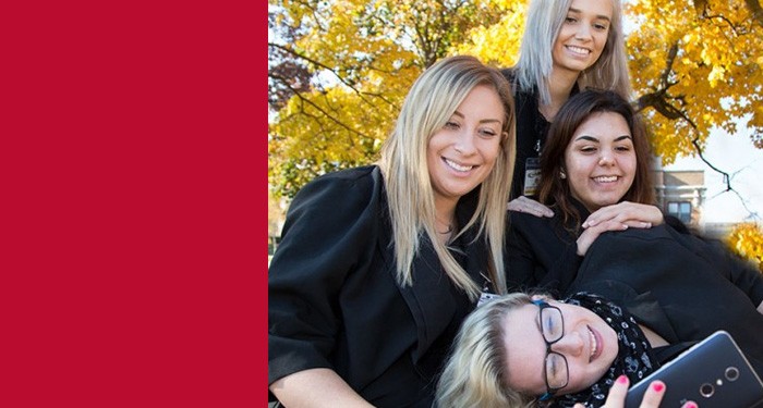 Happy students in a group smiling