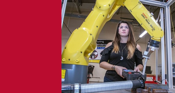 Student at a station in our robotics lab