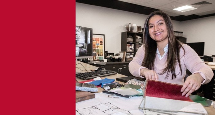 Gateway Interior design student at work station looking through fabric samples