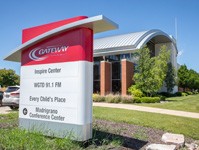 Inspire Center's large sign with the building in the background