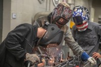 Gateway welding students work on a project that will honor fallen Vietnam War veterans