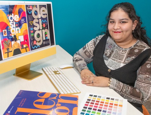 Graphic Design student at workstation
