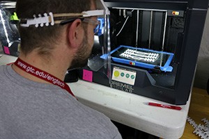 Person using a 3D printer