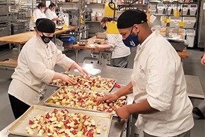 Culinary students preparing a meal