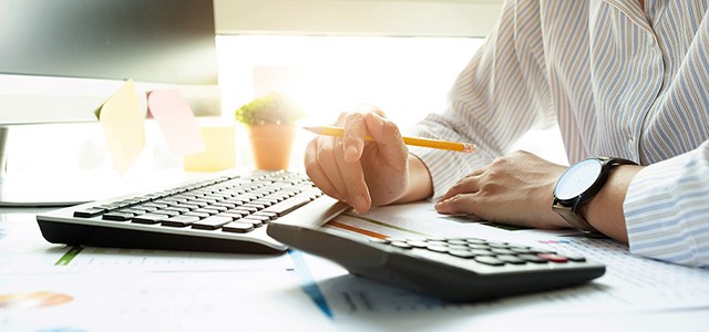 Closeup of bookkeepers hands at a computer keyboard