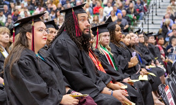 Students at 2025 commencement ceremony in caps and gowns