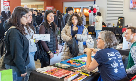 Students at an information table