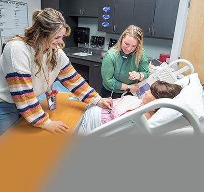 Nursing students learning in nursing lab