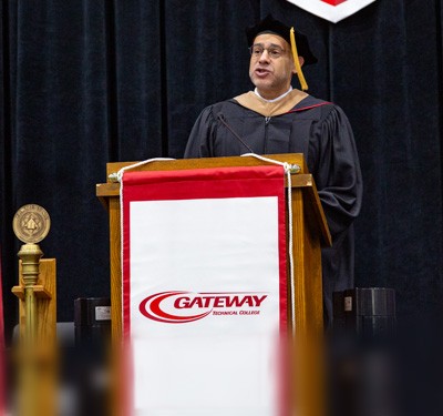 Web Saber speaking at May 20 Commencement Ceremony